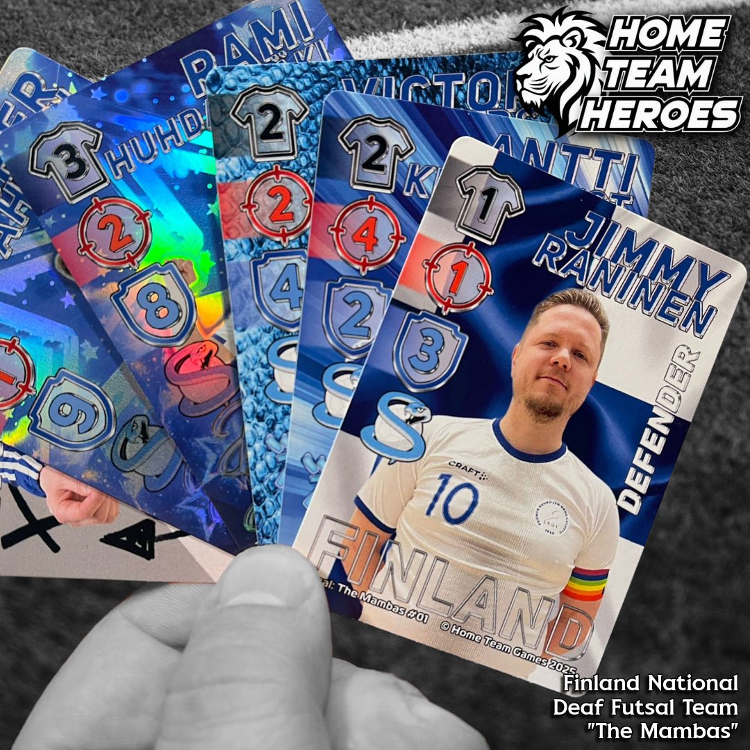 Hand holding The Mambas futsal card deck with Jimmy Raninen and blue stat designs on pitch background.