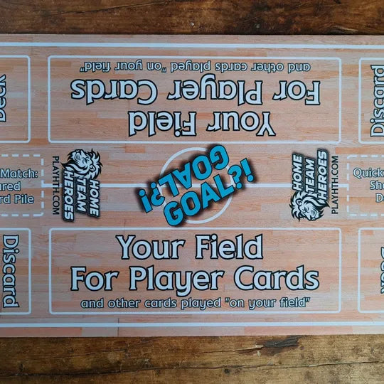 Top view of Home Team Heroes futsal playmat featuring indoor court design, player zones, and GOAL marker.