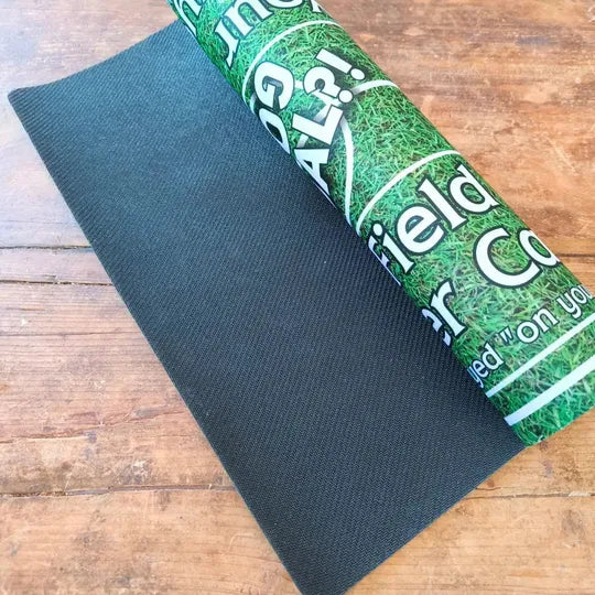 Rolled Home football playmat with realistic grass design and non-slip back, perfect for 2-player tabletop matches.