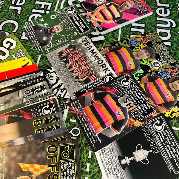 Wanderers FC Team Deck cards spread out on pitch-themed playmat, showing players, tactics and rare foil elements.