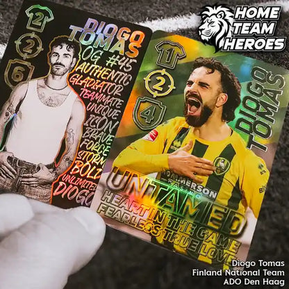 Hand holding Diogo Tomas - player of ADO Den Haag and Huuhkajat - collectible foil cards from Home Team Heroes football card game.