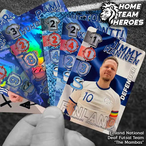 Hand holding The Mambas futsal card deck with Jimmy Raninen and blue stat designs on pitch background.