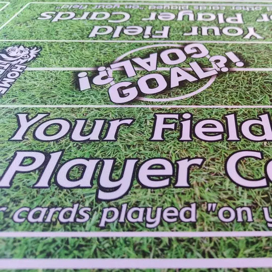 Close-up of grass pitch playmat showing the zone and card fields, details for immersive football gameplay.